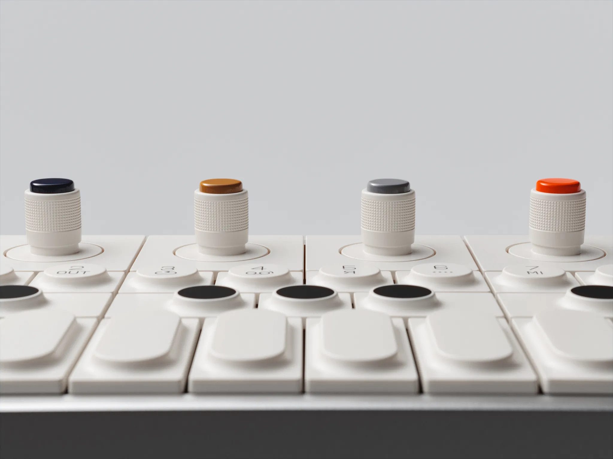 Modern MIDI controller with colorful control knobs.