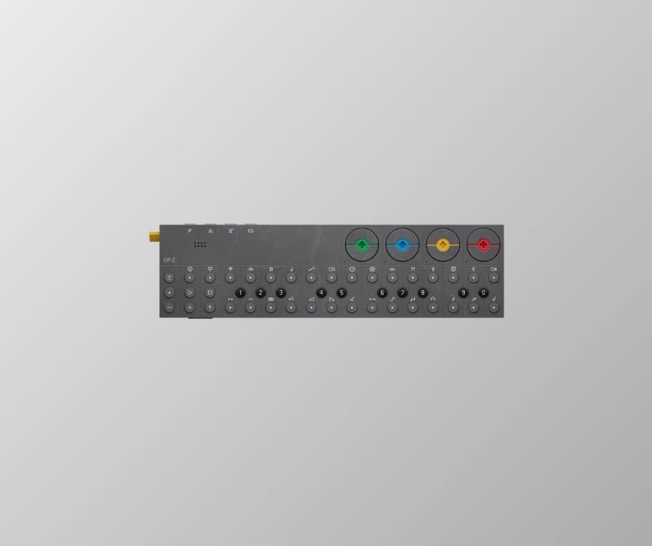 Remote control with colorful buttons on grey background.
